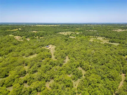a view of a field with an ocean