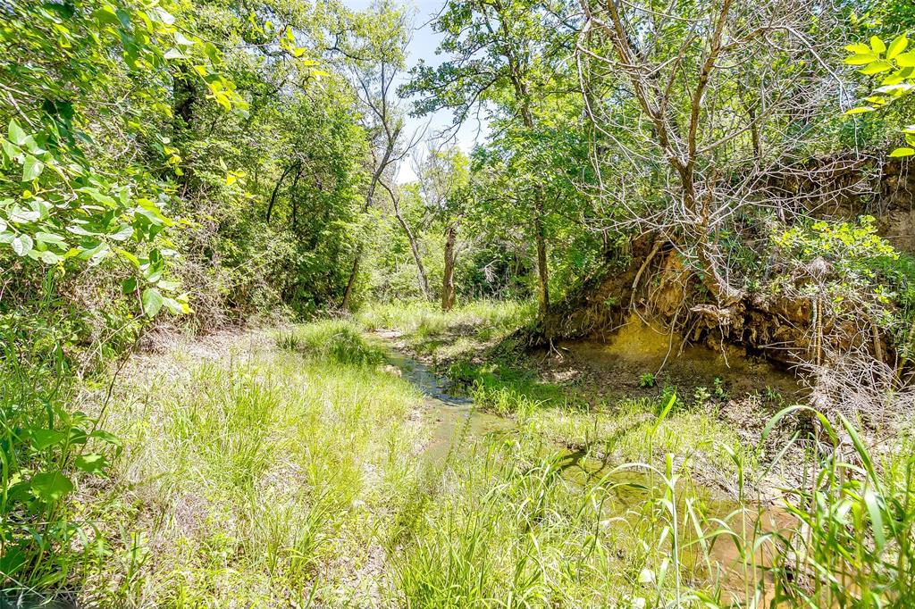 613 County Road 3848 Poolville, TX 76487 - Photo 30 of 40 a view of swimming pool from a lake view