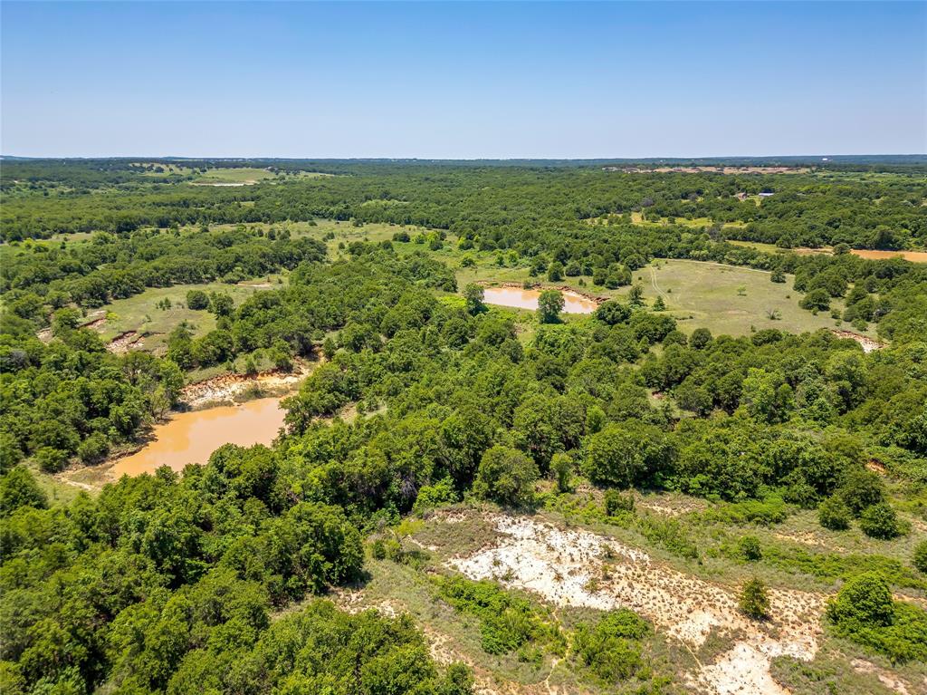 613 County Road 3848 Poolville, TX 76487 - Photo 37 of 40 a view of a large green field