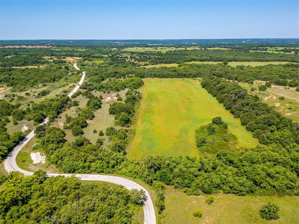 613 County Road 3848 Poolville, TX 76487 - Photo 5 of 40 a view of an outdoor space and a lake view