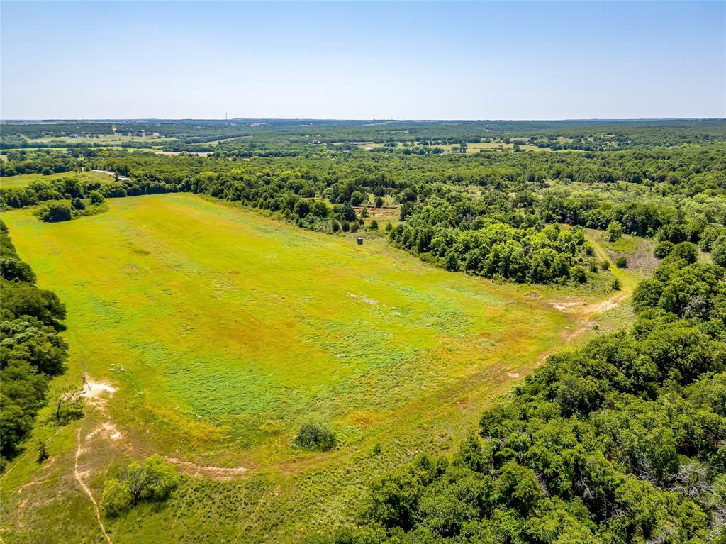 613 County Road 3848 Poolville, TX 76487 - Photo 6 of 40 a view of an ocean from a city