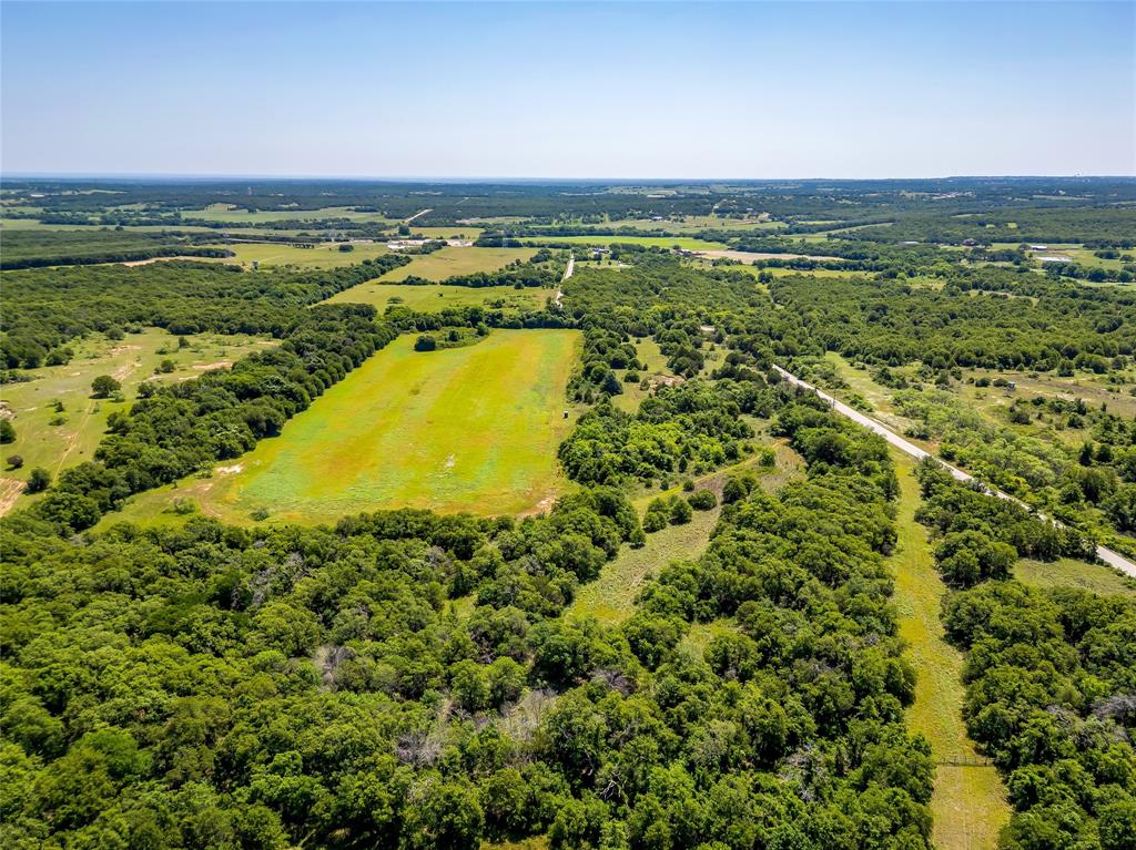 613 County Road 3848 Poolville, TX 76487 - Photo 7 of 40 a view of a city