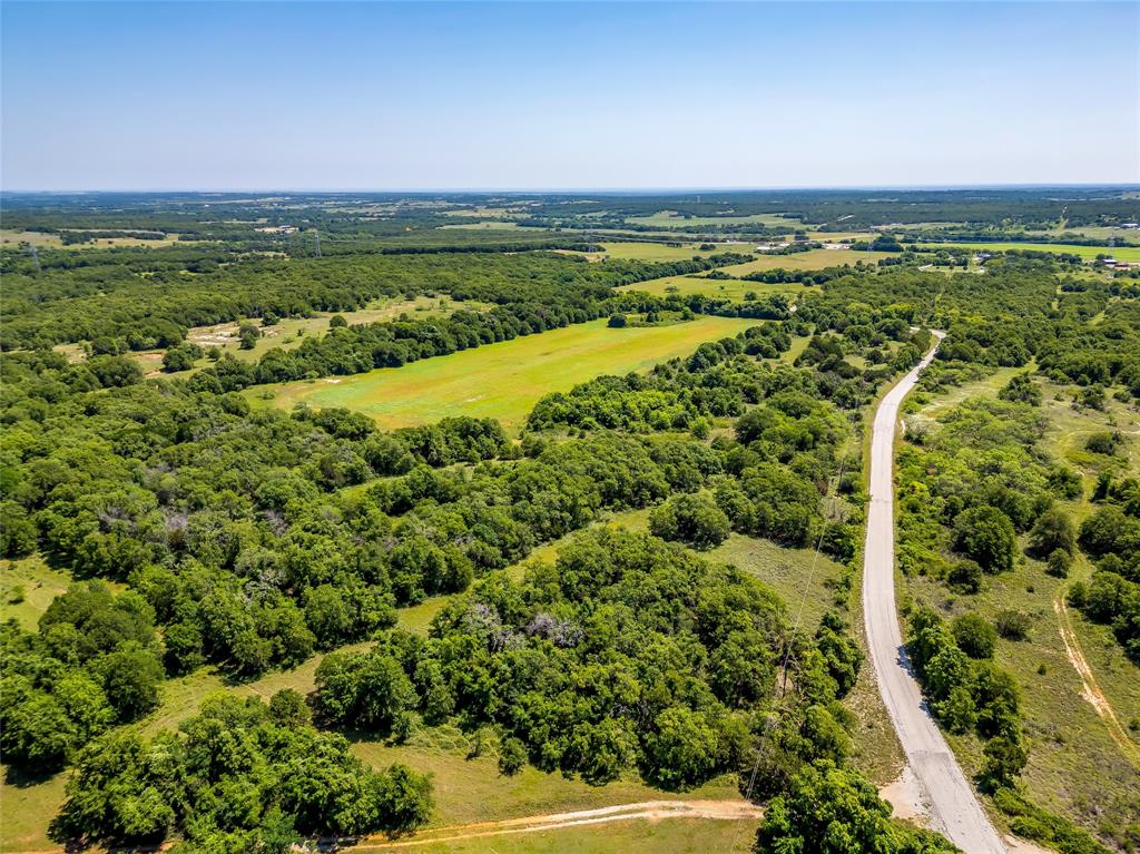 613 County Road 3848 Poolville, TX 76487 - Photo 8 of 40 a view of a city