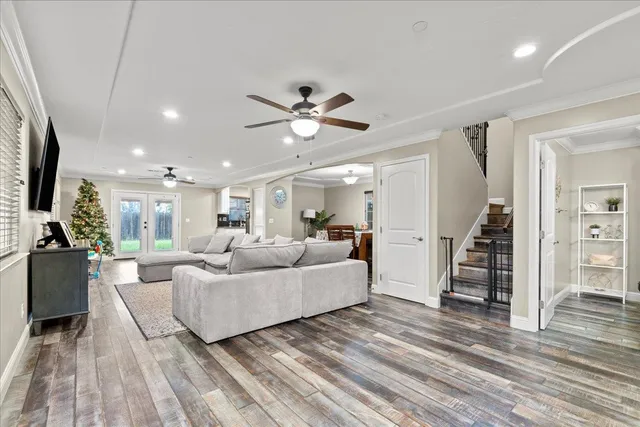 a very nice looking room with a large window and chandelier