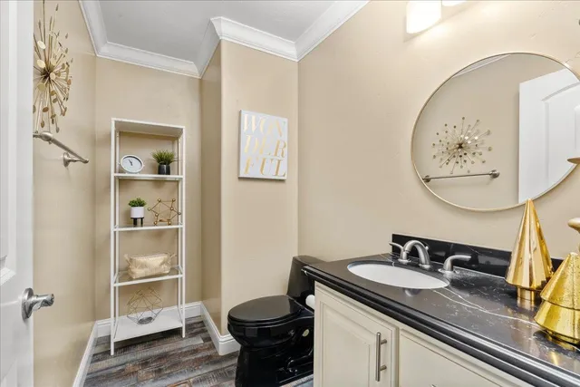 a bedroom with a large bed and a flat screen tv