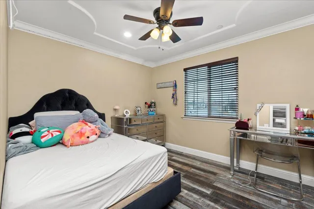 a bedroom with a workspace