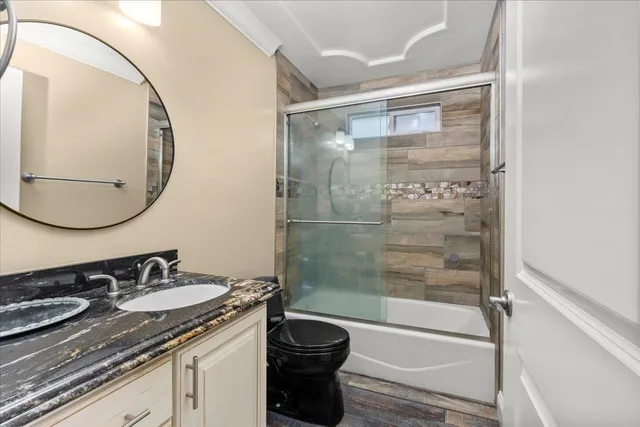 a view of a sink and dishwasher with wooden floor