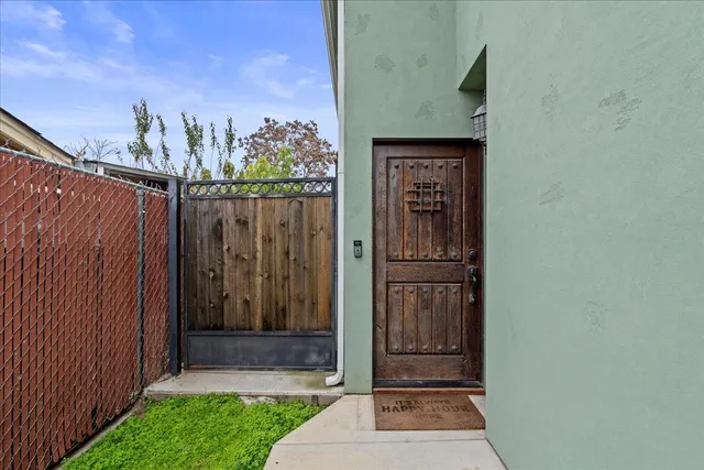a bedroom with furniture a fireplace and a ceiling fan