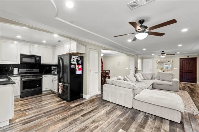 a view of a livingroom with furniture and wooden floor