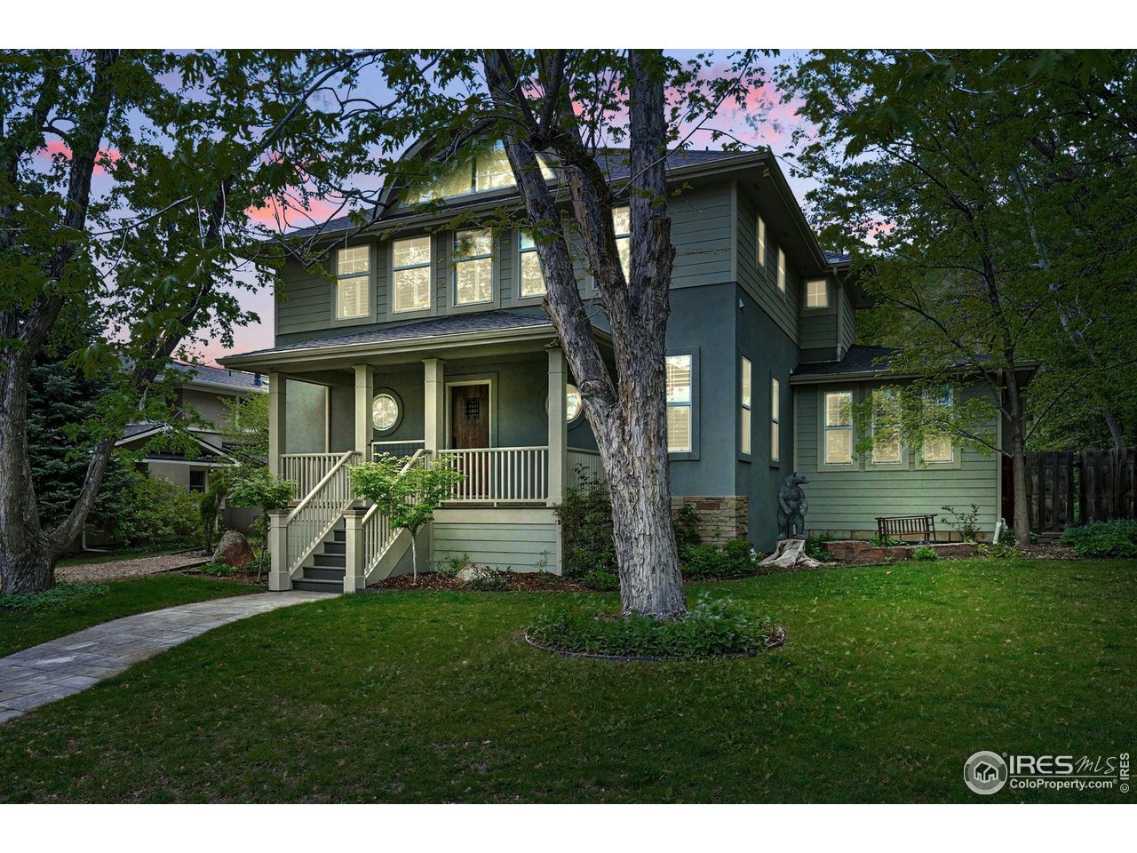 3219 7th Street Boulder, CO 80304 - Photo 1 of 34 a view of a brick house with a yard
