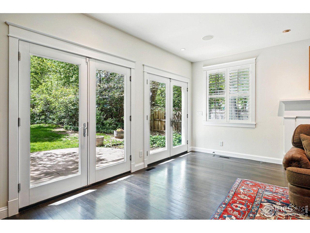 3219 7th Street Boulder, CO 80304 - Photo 15 of 34 a view of an empty room with wooden floor and a window