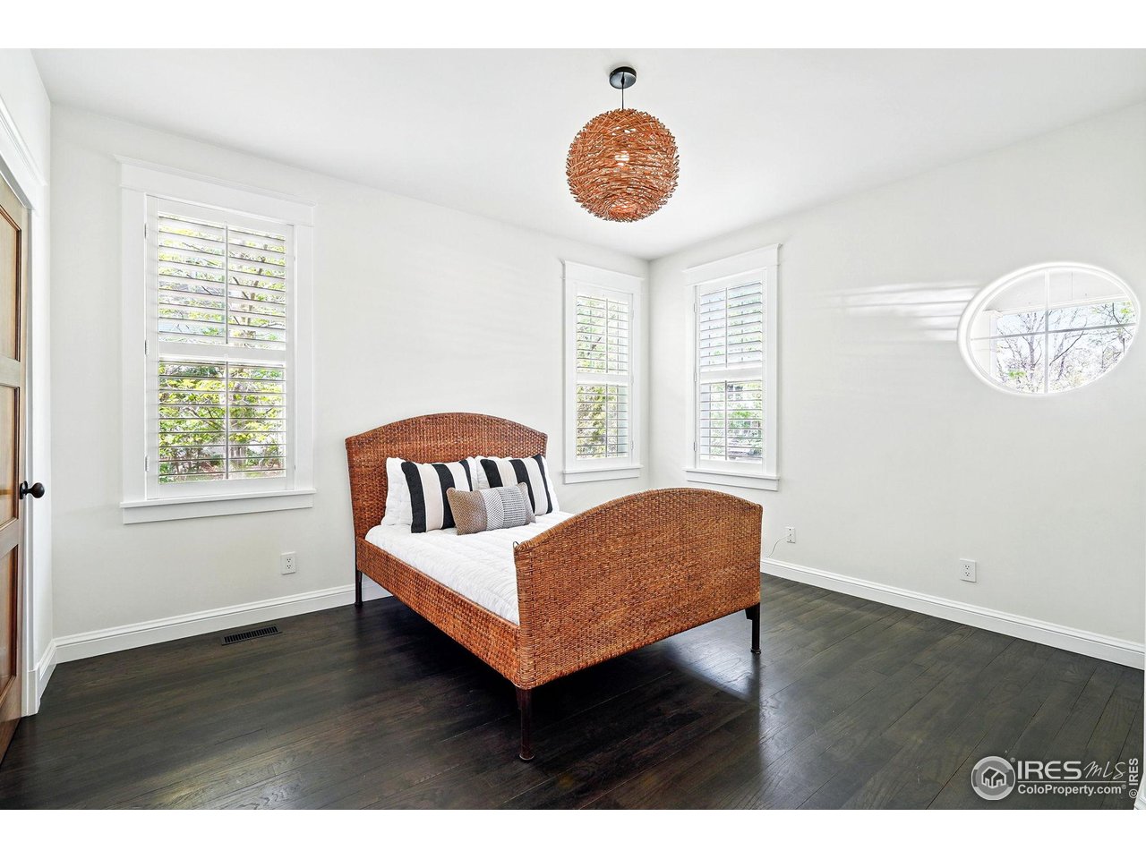 3219 7th Street Boulder, CO 80304 - Photo 17 of 34 a view of bedroom with furniture window and wooden floor
