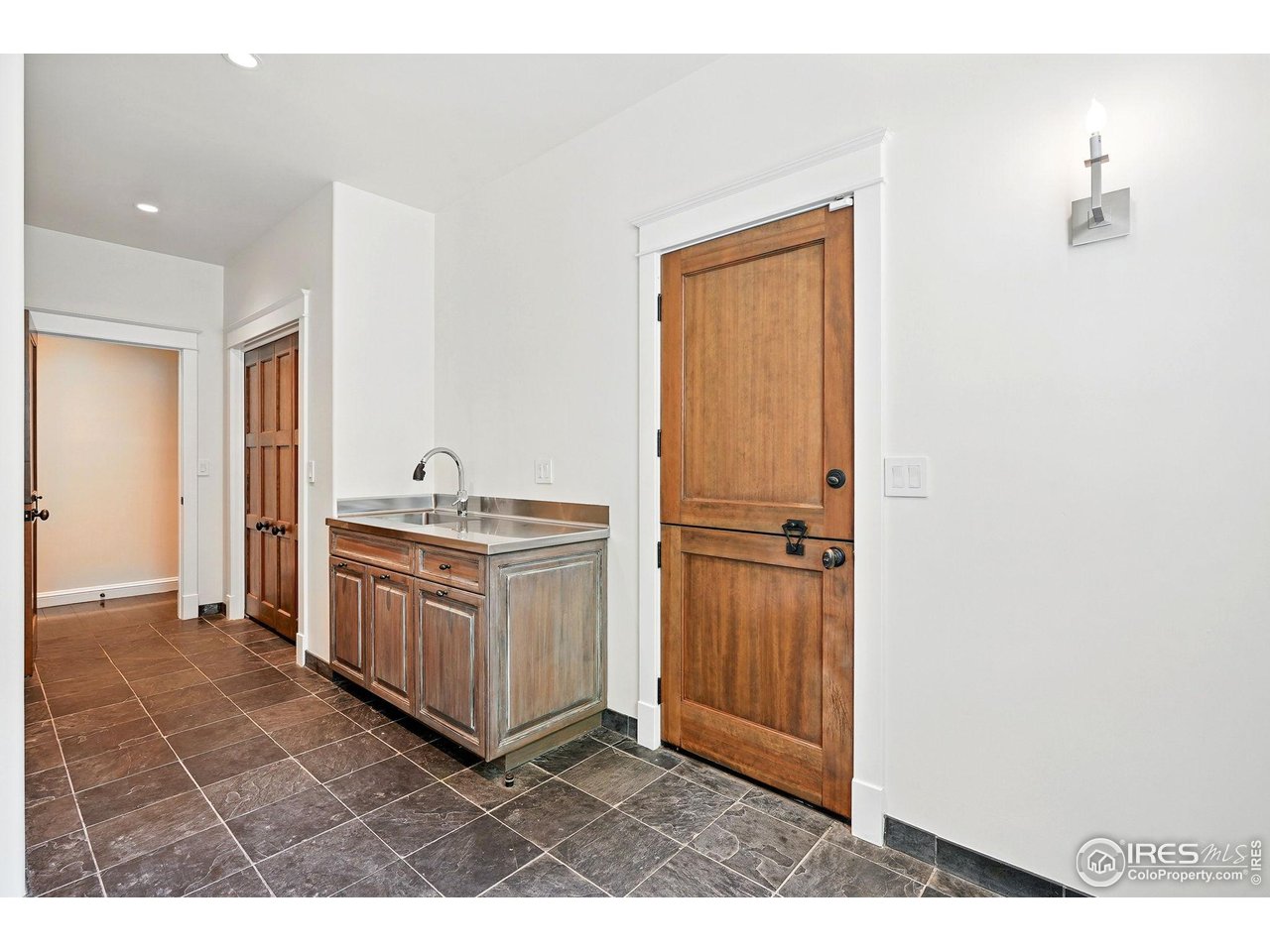 3219 7th Street Boulder, CO 80304 - Photo 18 of 34 a kitchen with granite countertop cabinets and window