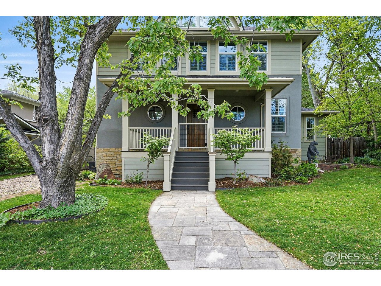 3219 7th Street Boulder, CO 80304 - Photo 2 of 34 a front view of a house with yard and green space