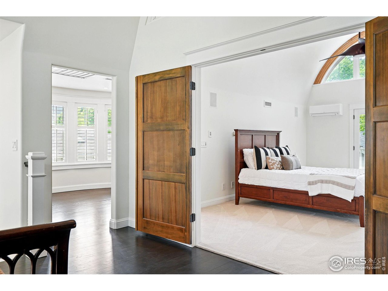 3219 7th Street Boulder, CO 80304 - Photo 21 of 34 a bedroom with a bed and a window