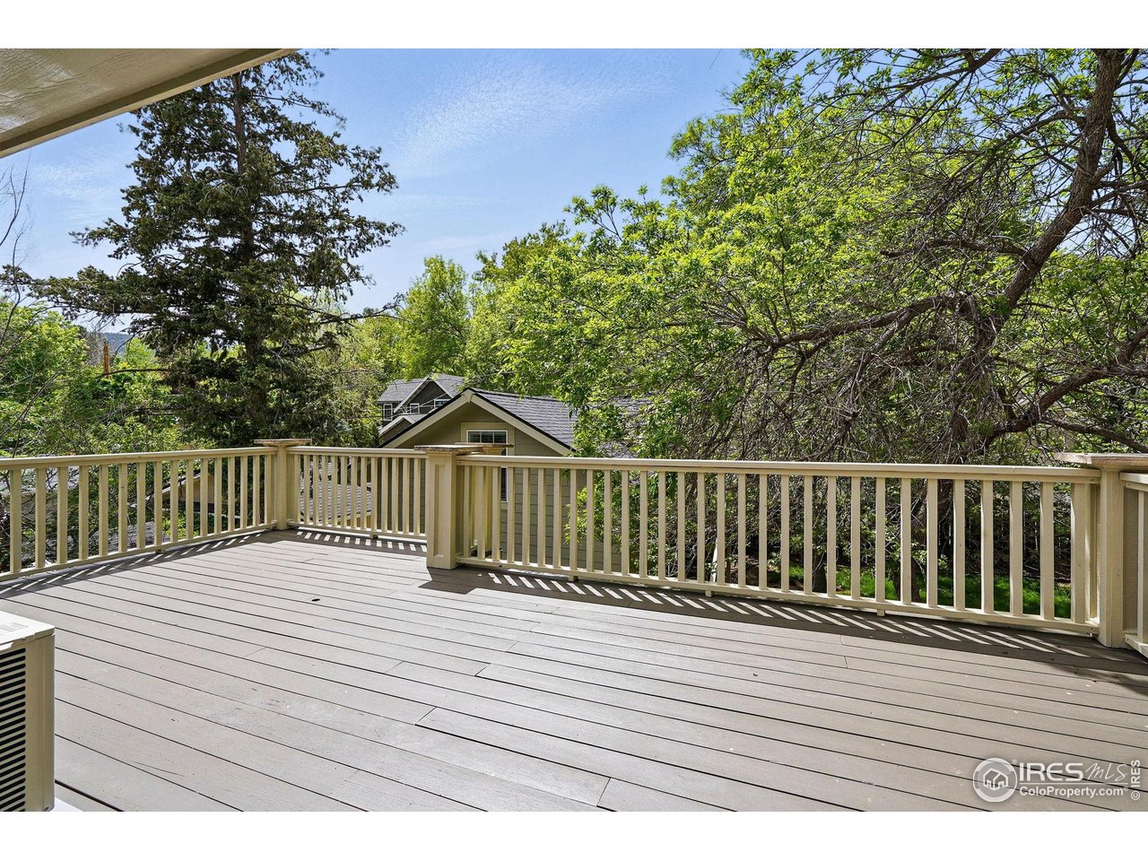 3219 7th Street Boulder, CO 80304 - Photo 24 of 34 a view of deck with wooden floor and fence and trees