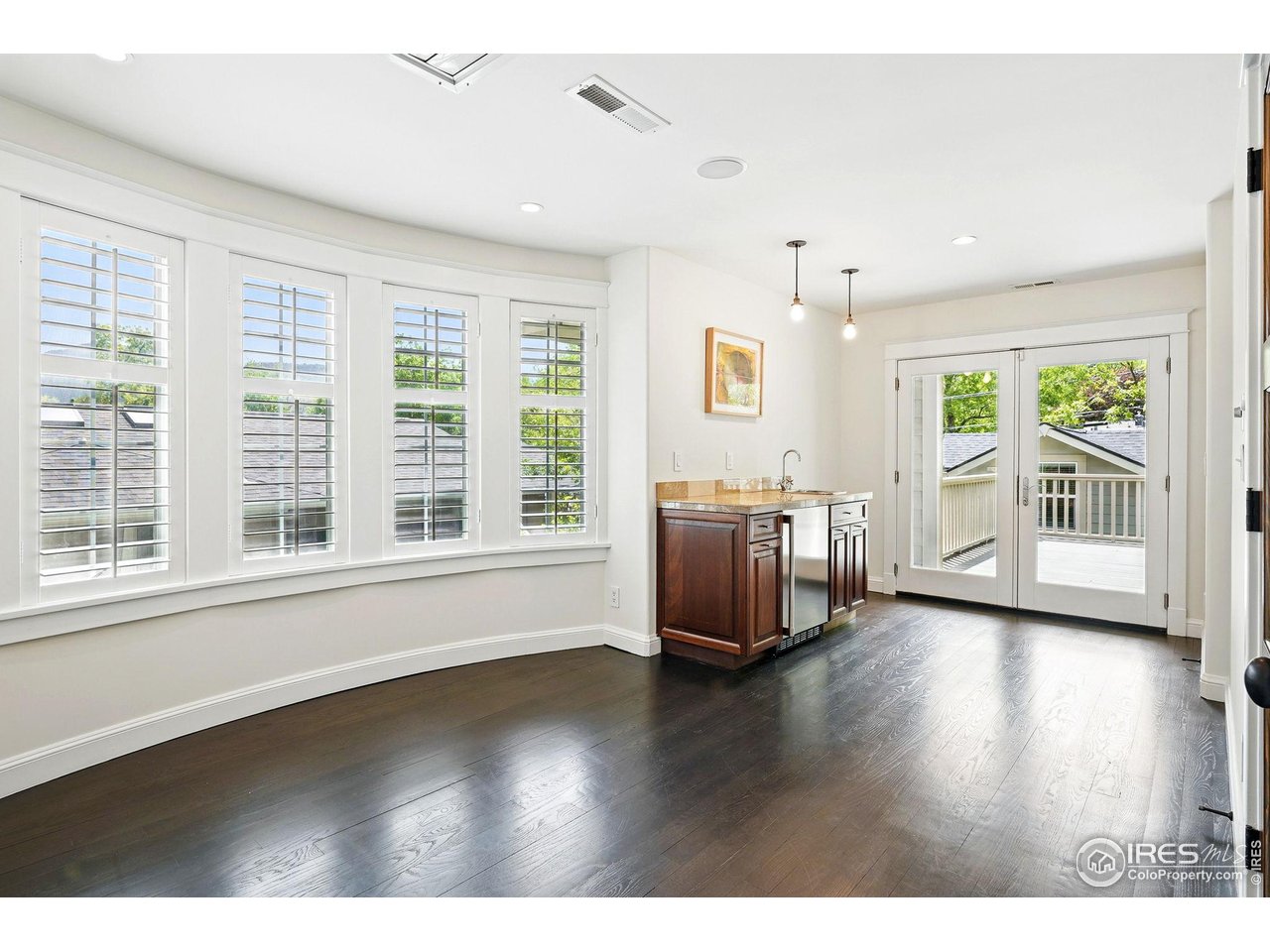 3219 7th Street Boulder, CO 80304 - Photo 28 of 34 a view of an empty room with a window and wooden floor