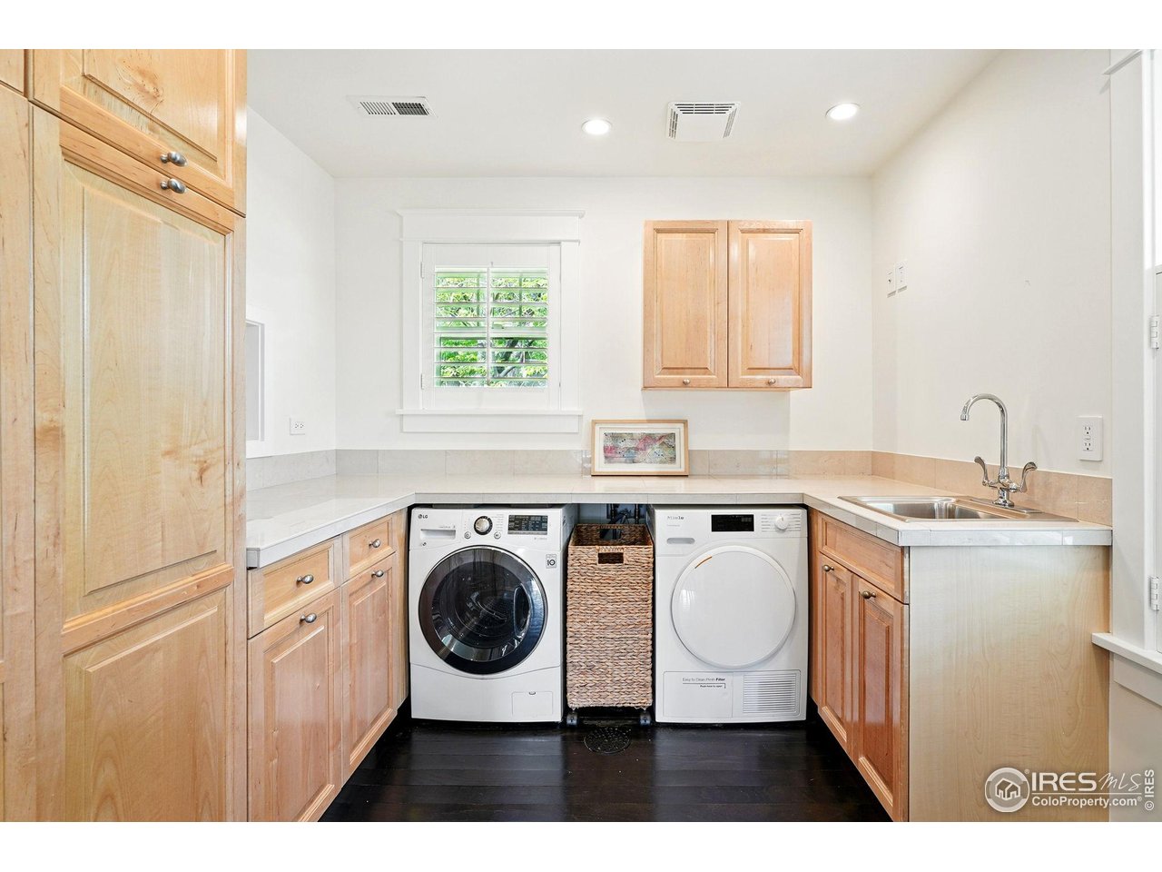 3219 7th Street Boulder, CO 80304 - Photo 29 of 34 a utility room with cabinets washer and dryer