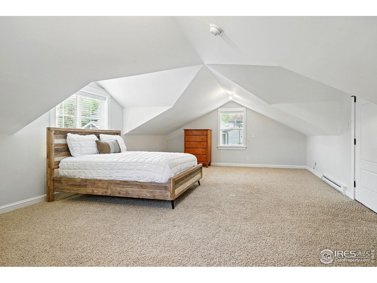 3219 7th Street Boulder, CO 80304 - Photo 33 of 34 a bedroom with a large bed and a window