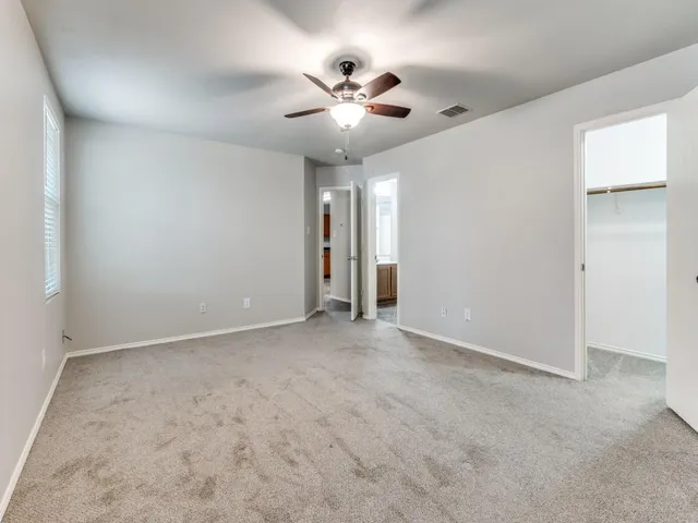 a bathroom with a tub sink shower and a mirror