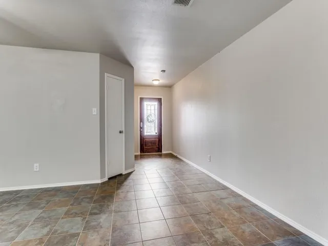 a view of an empty room and window