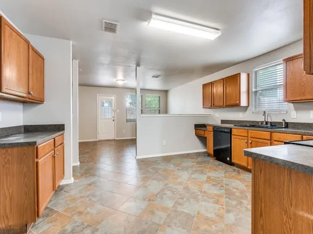 a view of a kitchen with a sink