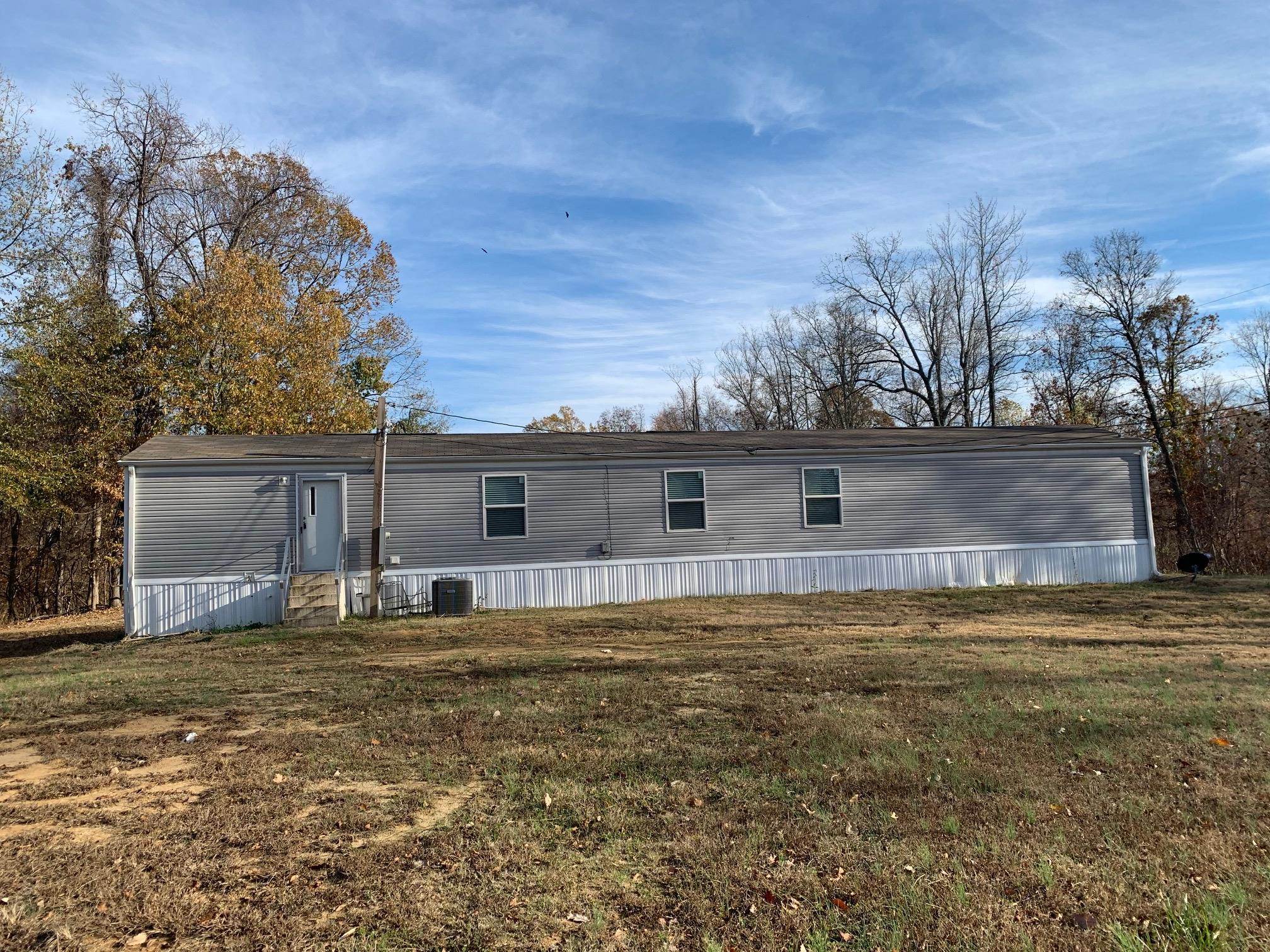 4169 Chisholm Lake Road Ripley, TN 38063 - Photo 2 of 21 a view of a house with a yard