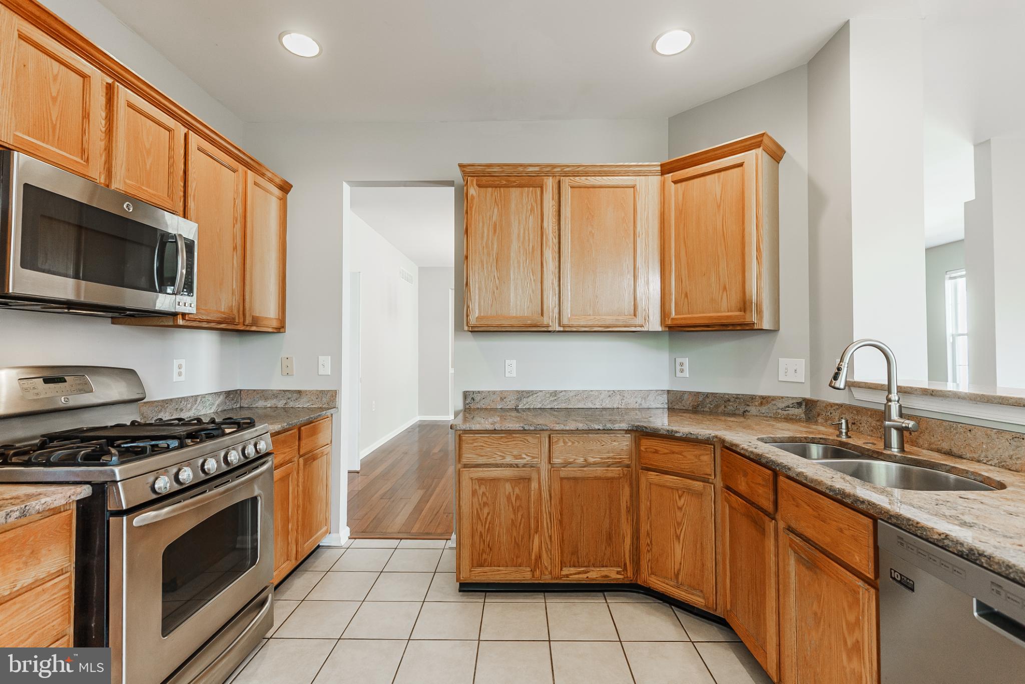 1484 Quaker Ridge West Chester, PA 19380 - Photo 20 of 50 Modern kitchen with warm wood cabinetry.