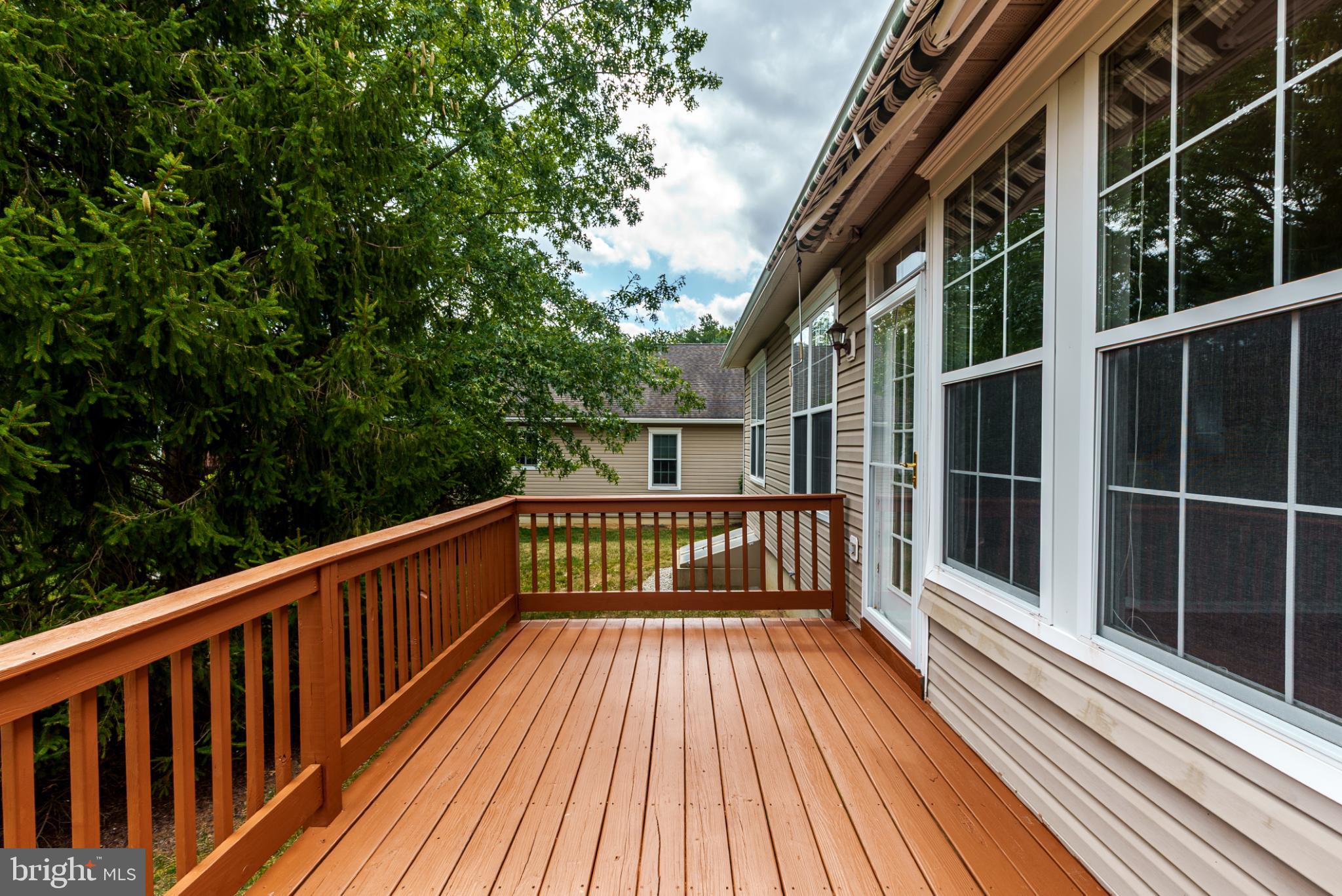 1484 Quaker Ridge West Chester, PA 19380 - Photo 31 of 50 Sunny deck retreat surrounded by greenery.