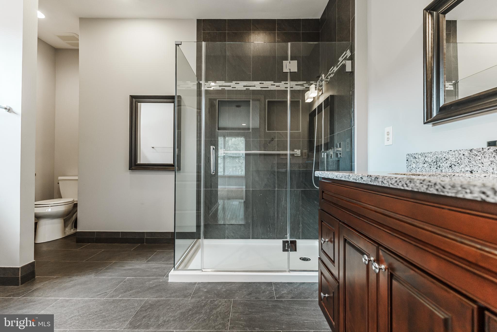 1484 Quaker Ridge West Chester, PA 19380 - Photo 43 of 50 Sleek renovated bathroom with two separate sinks.