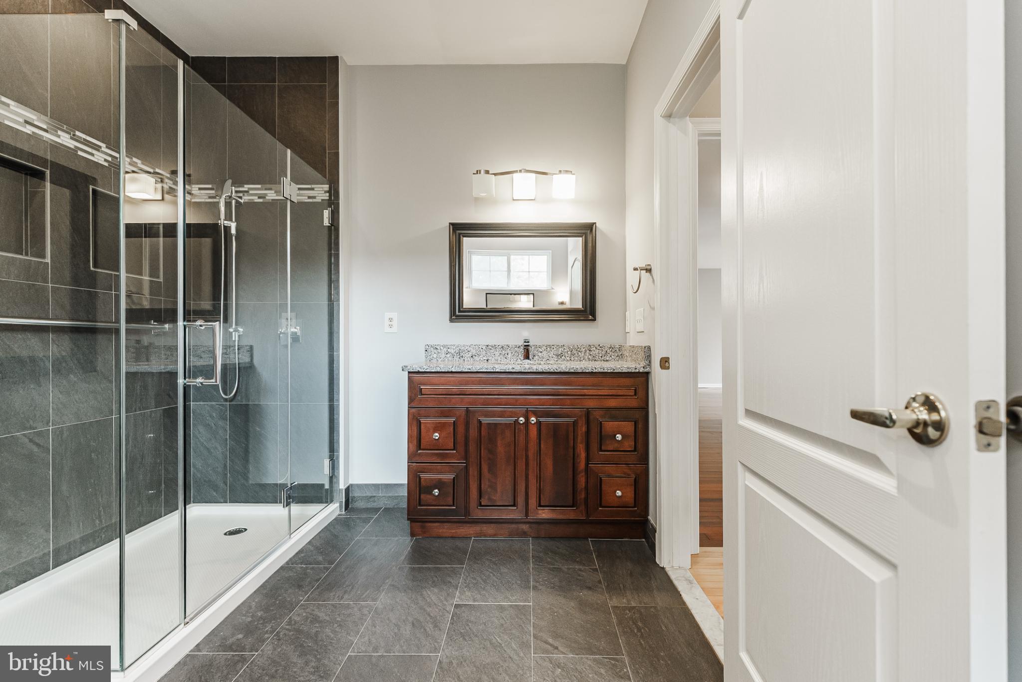 1484 Quaker Ridge West Chester, PA 19380 - Photo 44 of 50 Sleek modern bathroom with elegant finishes.