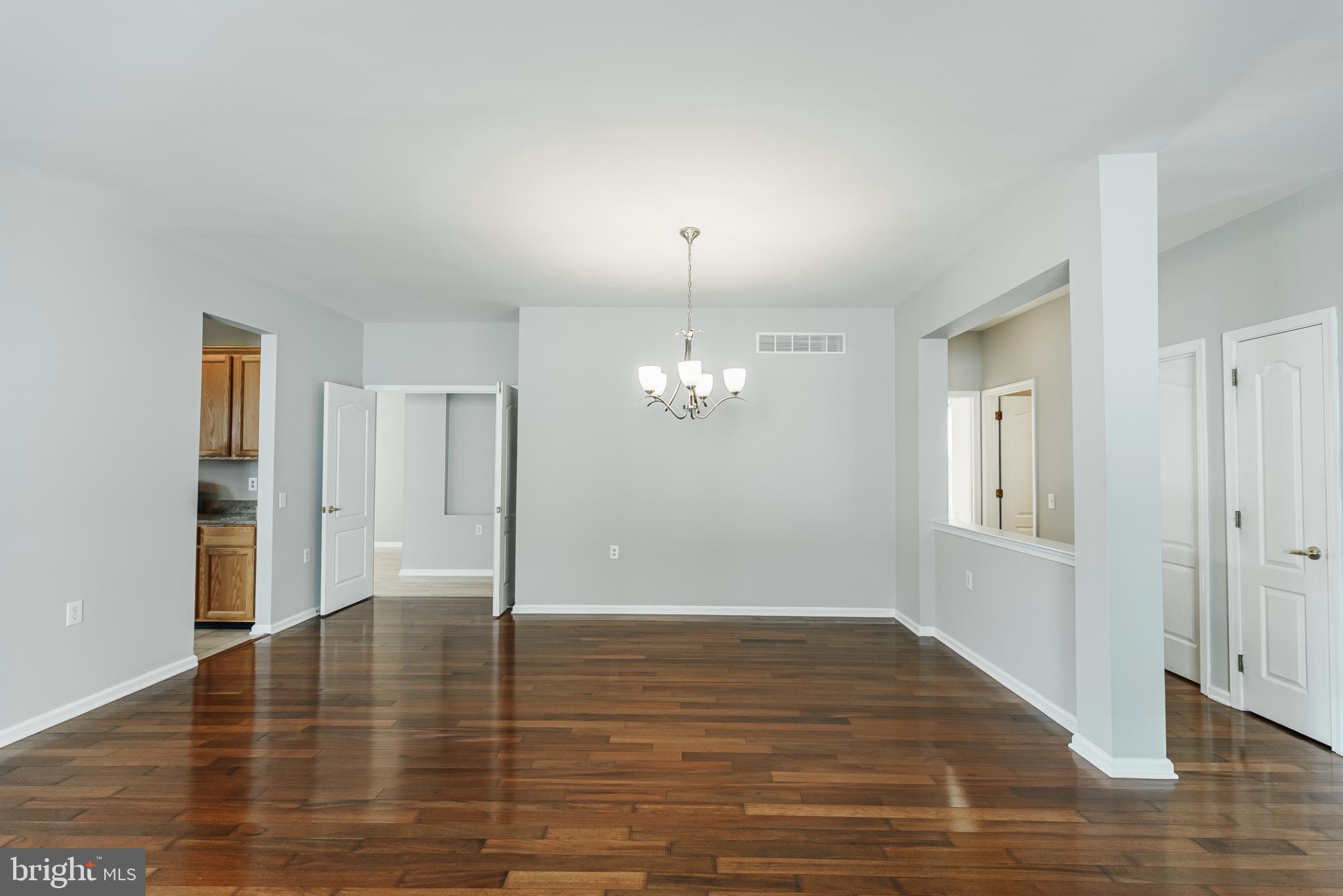 1484 Quaker Ridge West Chester, PA 19380 - Photo 8 of 50 Spacious, light-filled living and dining area.