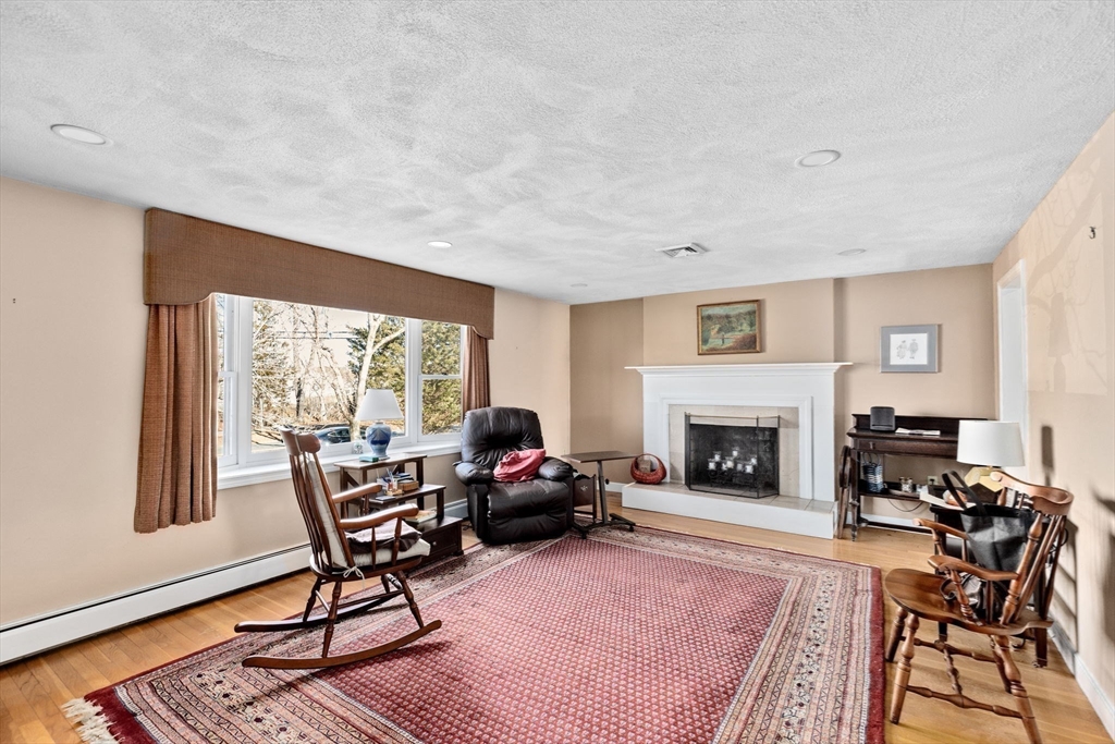 131 Free Street Hingham, MA 02043 - Photo 6 of 39 a living room with furniture and a fireplace