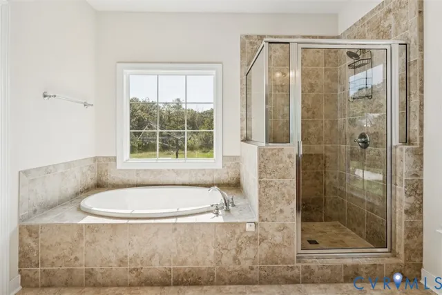 a bathroom with a tub and window