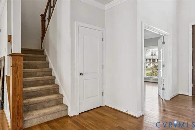 a view of an entryway with wooden floor