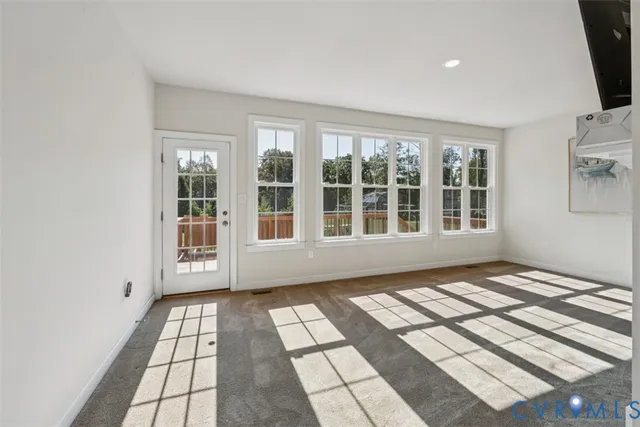 a view of empty room with windows