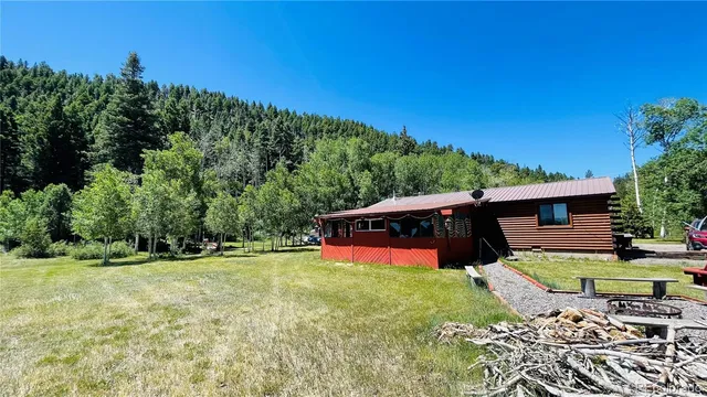 a swimming pool with some trees in the background