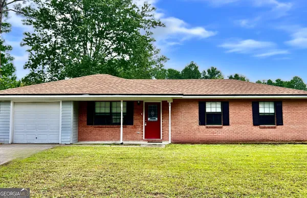a front view of a house with yard
