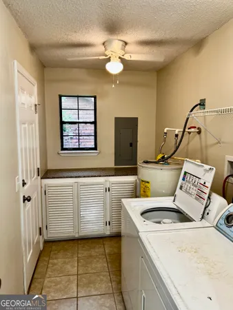 a kitchen with a stove a sink and a refrigerator