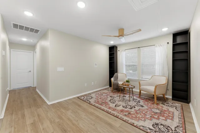 a living room with furniture and a rug
