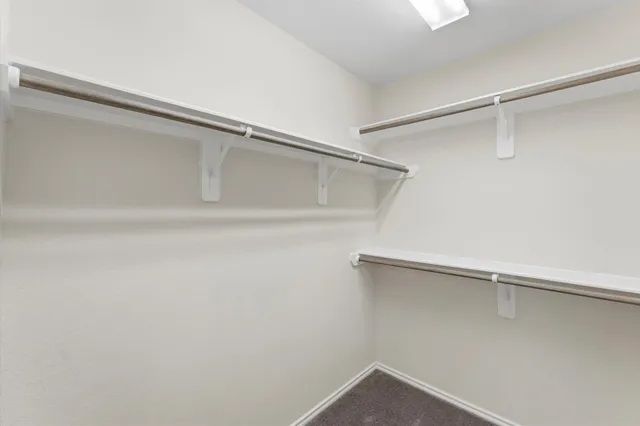 a view of an empty walk in closet