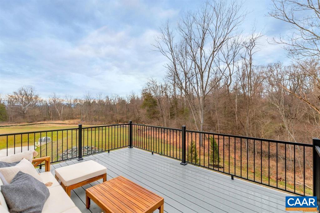 2837 Rambling Brook Lane Crozet, VA 22932 - Photo 12 of 24 a view of balcony with wooden floor and seating space