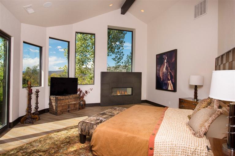 184 Arrowhead Drive Edwards, CO 81632 - Photo 13 of 23 a bedroom with a bed and wooden floor