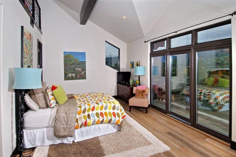 184 Arrowhead Drive Edwards, CO 81632 - Photo 15 of 23 a bedroom with a bed and wooden floor