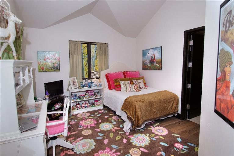 184 Arrowhead Drive Edwards, CO 81632 - Photo 17 of 23 a bedroom with a bed and a fireplace