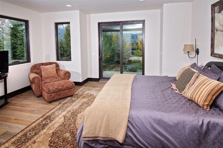 184 Arrowhead Drive Edwards, CO 81632 - Photo 18 of 23 a bedroom with a bed and glass window