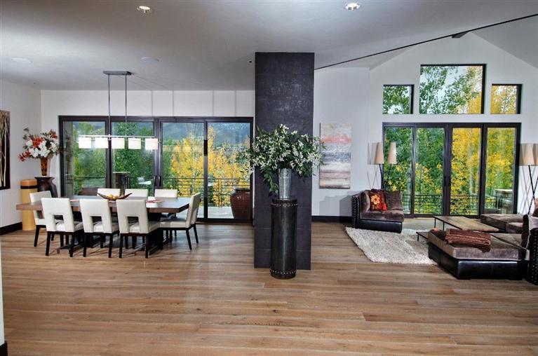 184 Arrowhead Drive Edwards, CO 81632 - Photo 7 of 23 a living room with furniture floor to ceiling window and a table