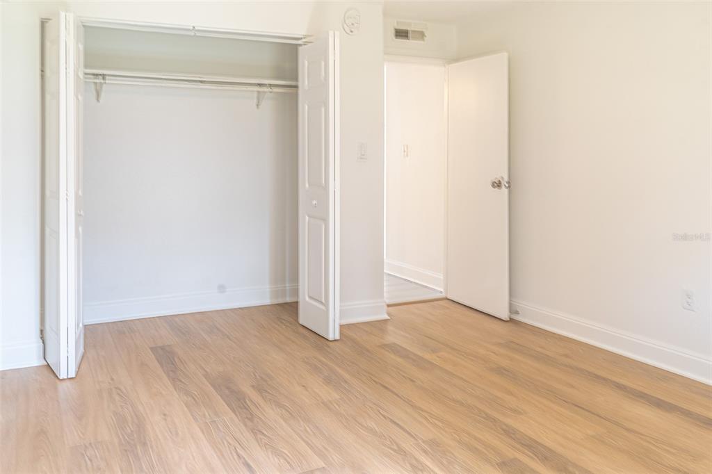 363 South McMullen Booth Road, Unit 107 Clearwater, FL 33759 - Photo 9 of 21 a view of an empty room with wooden floor