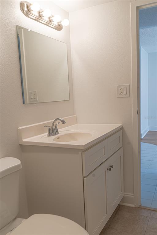 363 South McMullen Booth Road, Unit 107 Clearwater, FL 33759 - Photo 10 of 21 a bathroom with a sink and a toilet