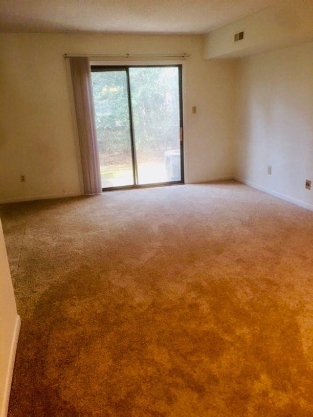 2102 Spring Forest Road, Unit 2102 Raleigh, NC 27615 - Photo 6 of 6 a view of an empty room with a window